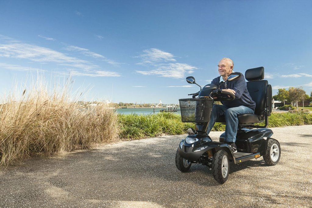 Older Man On Mobility Scooter — Mobility Shop In Tweed Heads, NSW