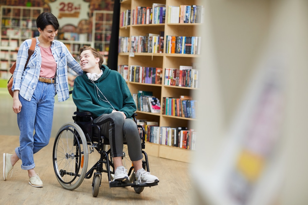 Disabled Student At Library — Mobility Shop In Tweed Heads, NSW