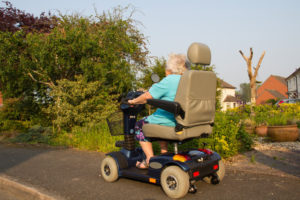 Old Lady On Her Mobility Scooter — Mobility Shop In Tweed Heads, NSW