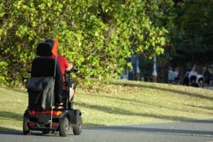 Elderly Riding A Mobility Scooter