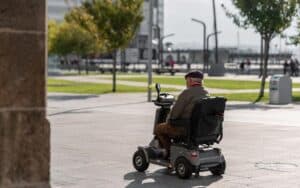 Man Riding A Mobility Scooter