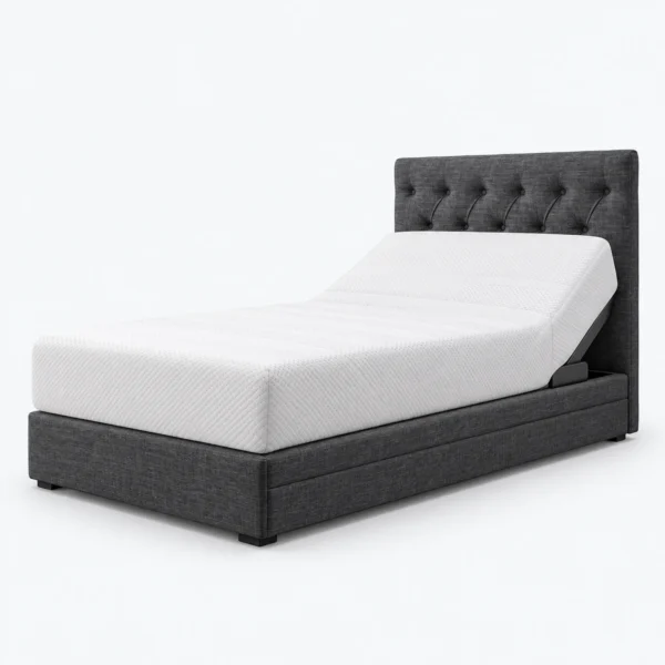 A dark gray upholstered adjustable bed with a tufted headboard and a white mattress on a plain white background.