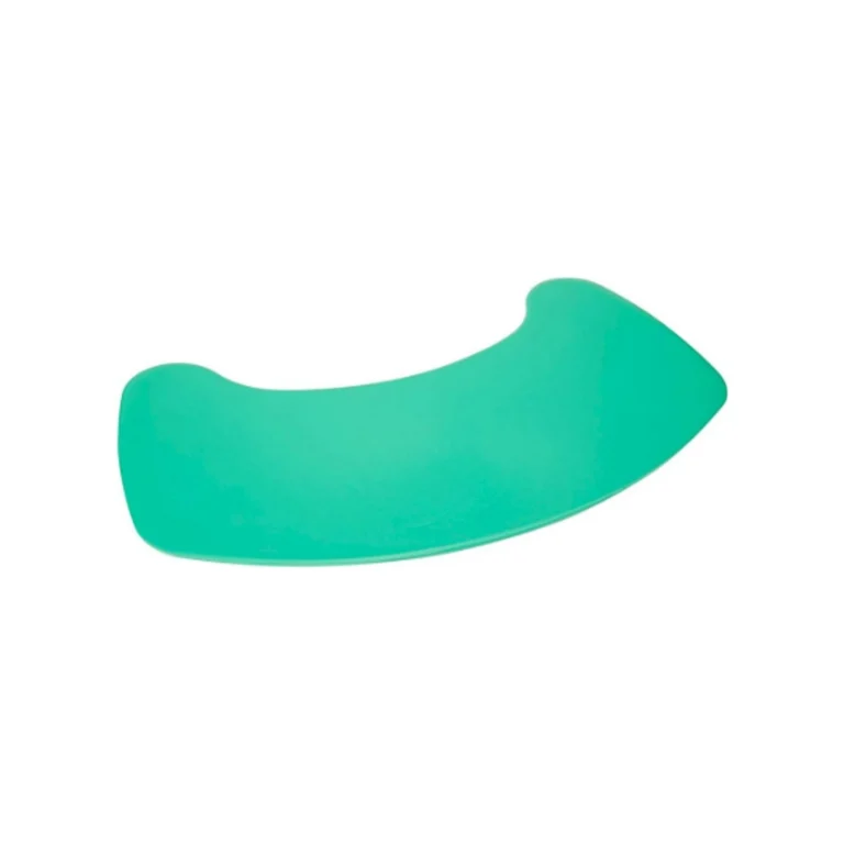 A green curved plastic spatula on a white background.