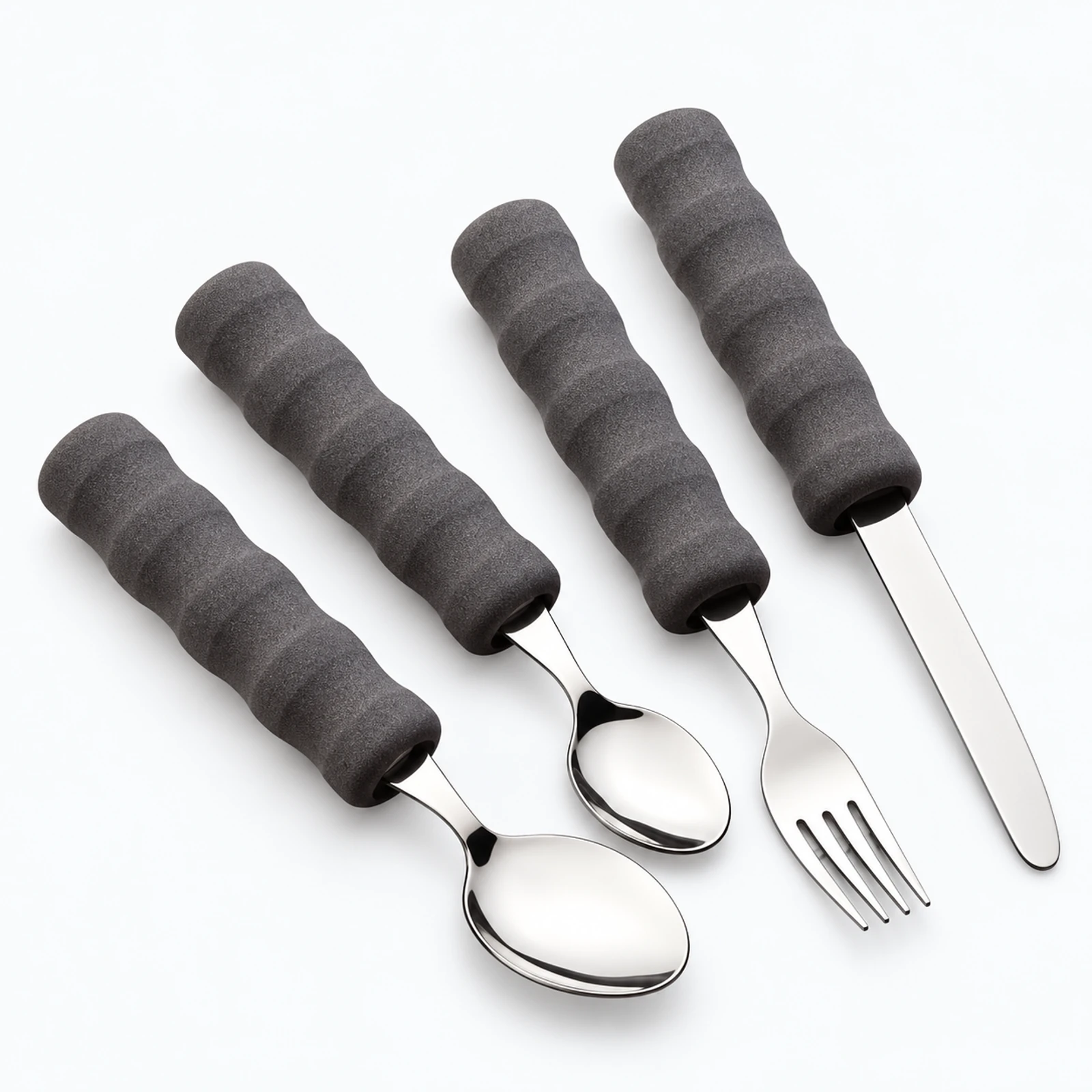 A set of four stainless steel utensils with dark gray textured handles, including two spoons, a fork, and a knife, arranged on a white background.