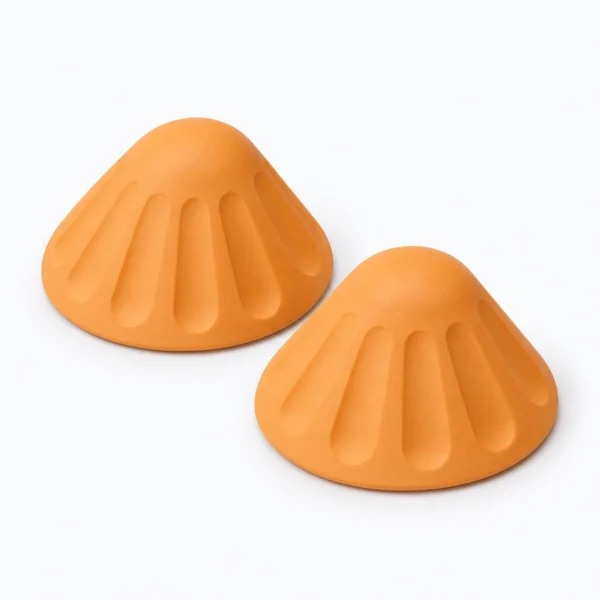 Two orange silicone citrus juicer cones on a white background.