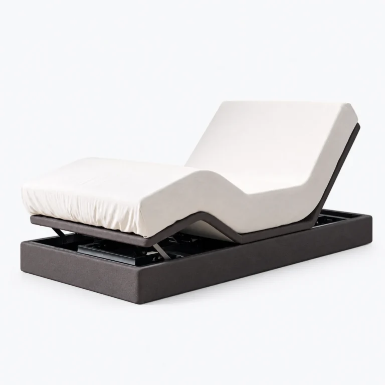 A white adjustable mattress on a dark motorized base, shown against a plain white background.