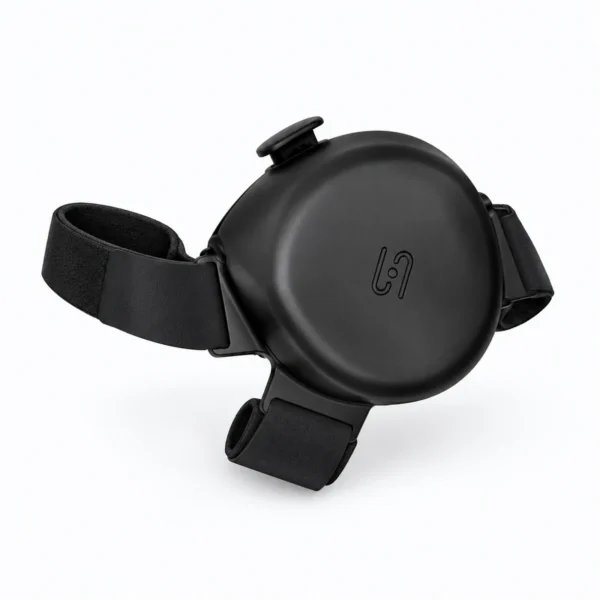 A black round plastic device with adjustable straps, shown on a white background.