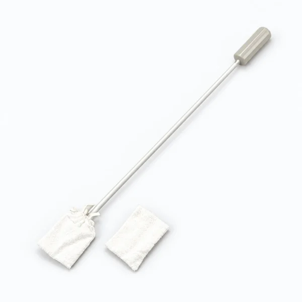A long-handled cleaning mop with a gray grip lies diagonally on a white background, beside two white replacement mop pads.